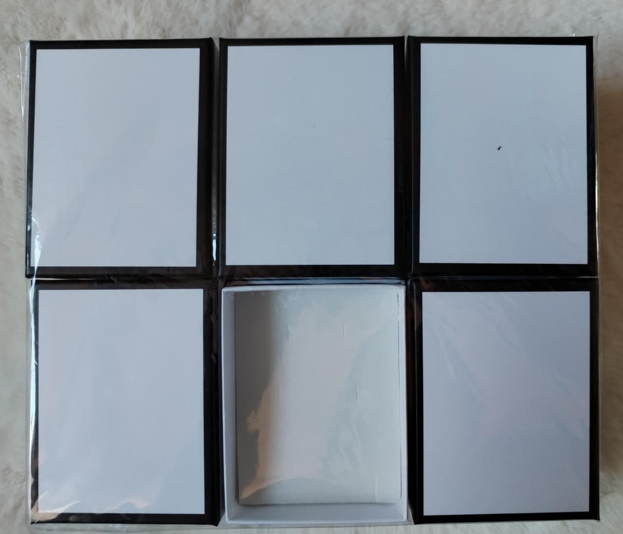 Docena de cajas blanca con borde negro 7*9